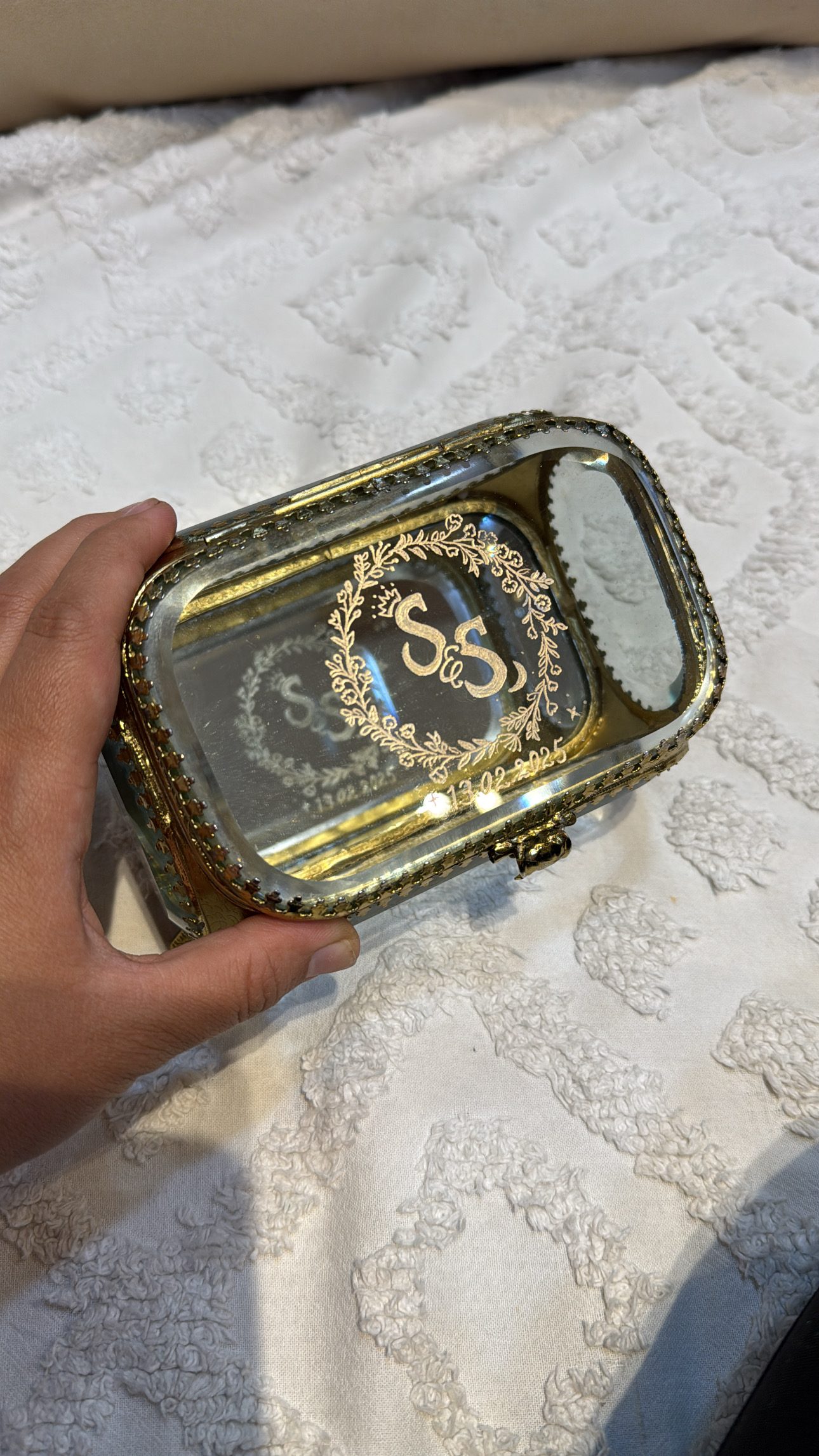 Gold monogram engraved on a glass keepsake box
